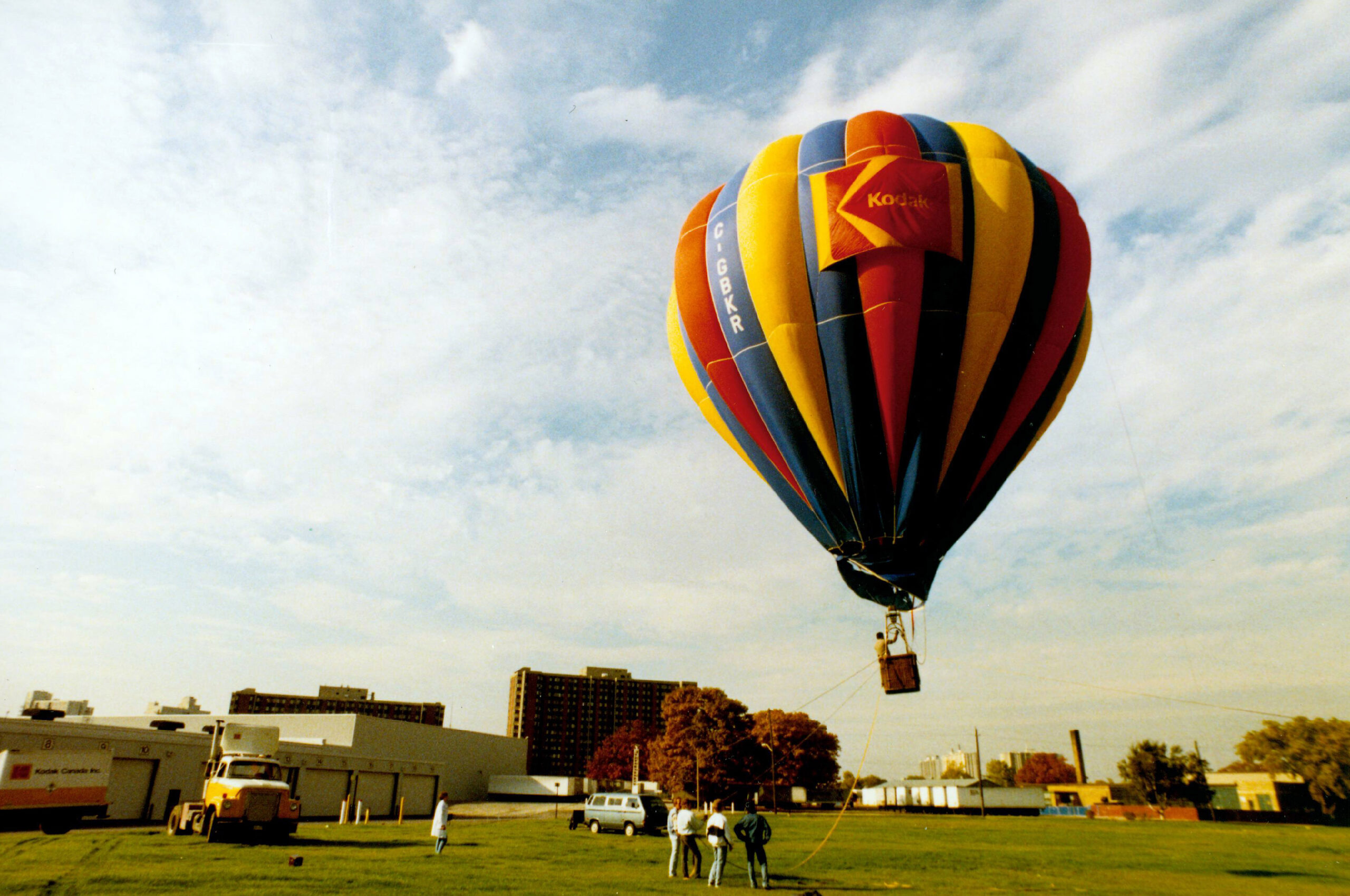 Hot air balloon with red, yellow and blue stripes with the Kodak logo