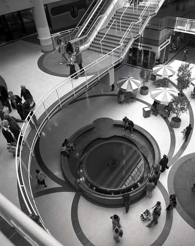 A black and white image of an overheard view of the Eaton's Centre water fountain