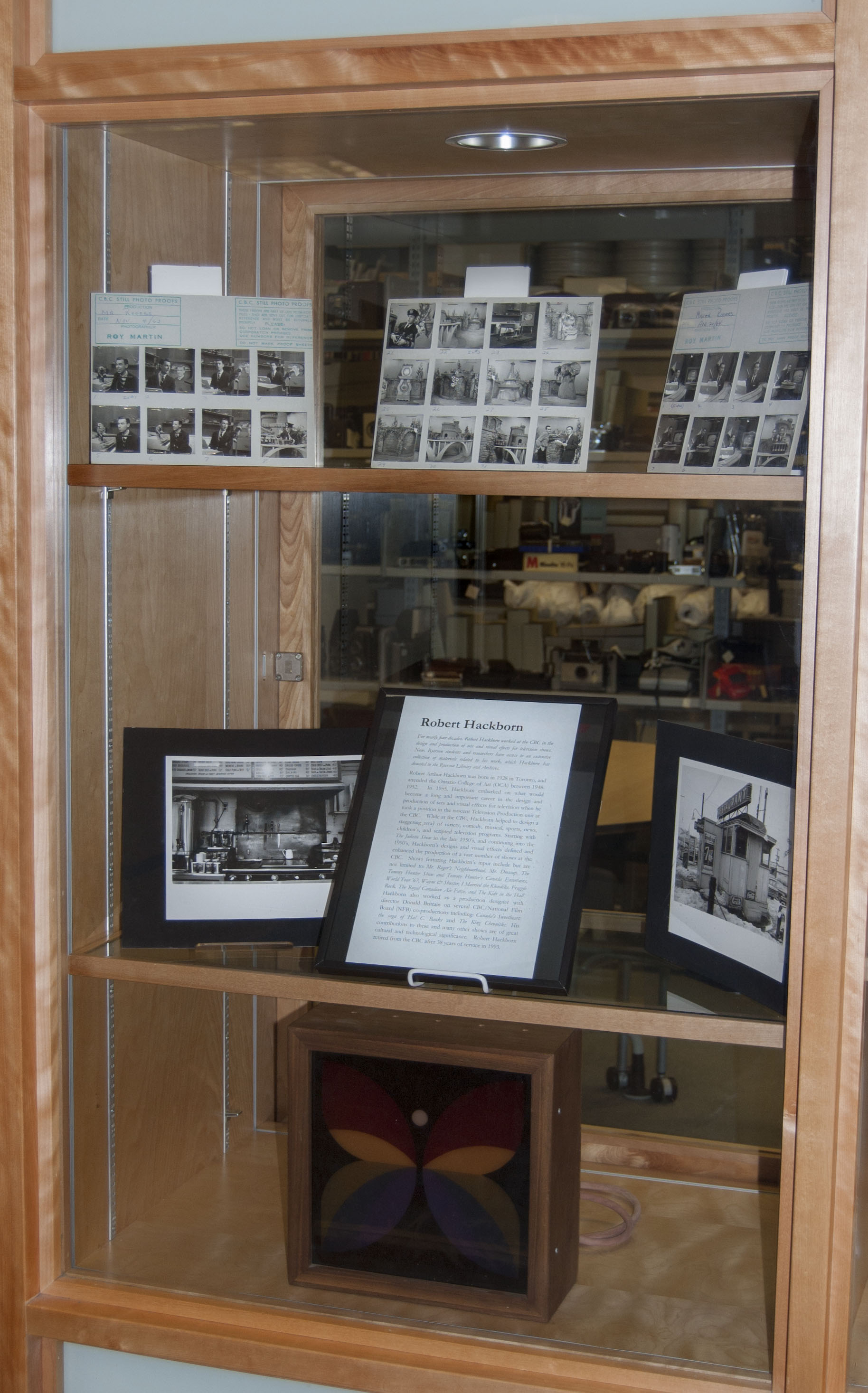 This section of the display shows photographs taken by Hackborn during his career which document the processes of working on a television set.