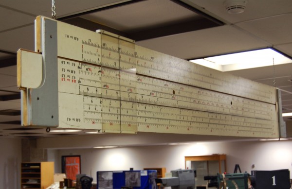 The Model Slide Rule, hung on display at the Ryerson Archives