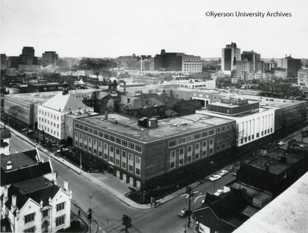 Howard Kerr Hall under construction with Ryerson Hall (originally Toronto Normal School) in the Quad. Only the facade of Ryerson Hall remains standing today. In the middle distance is Eaton's College Street store, now College Park, [ca. 1962], RG 4-116, Folder 4 copyright Herb Nott & Co. Ltd.