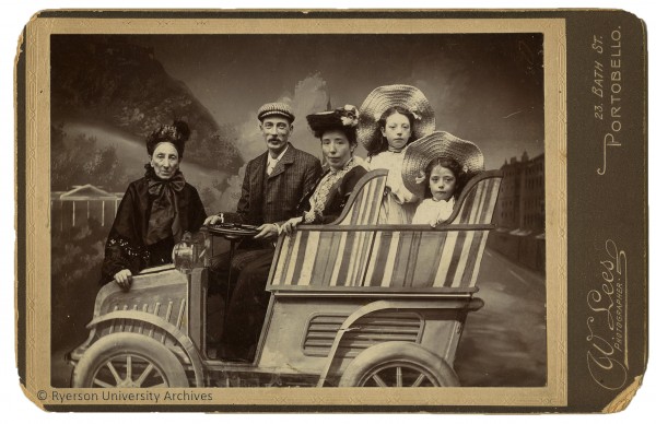 Figure 1: 2008.001.221. William Lees, [Family group sitting in a studio car prop], cabinet card [between 1898 and 1914], Portobello, Scotland, 16.4 x 10.3 cm.