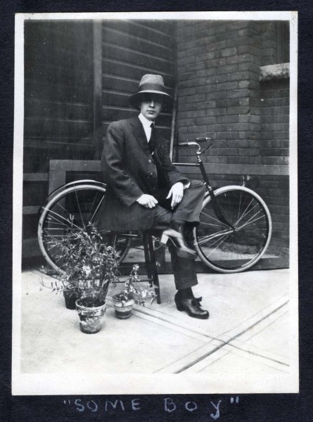 'Some boy' posed in front of a bike. [ca. 1911]