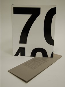 White hard cover book with black numbers on the cover.