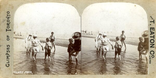 Group of people wading in water on a Munro Beach