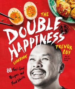 Cookbook cover, featuring a photo of the author along with eggs and a plate of chicken.