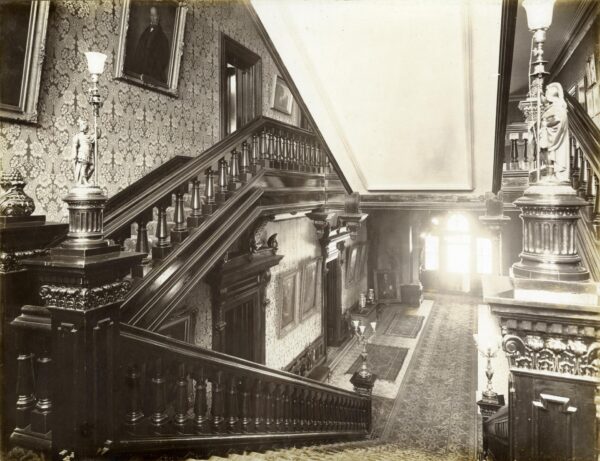 Interior view of Government House showing staircases to ground floor and up to second story.