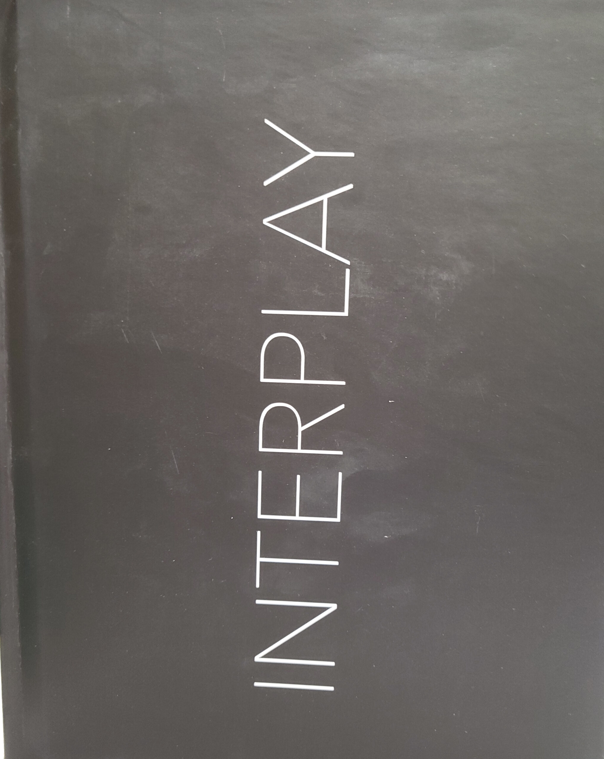 Photograph of front cover of book Interplay of Light by Jordana Petruccelli