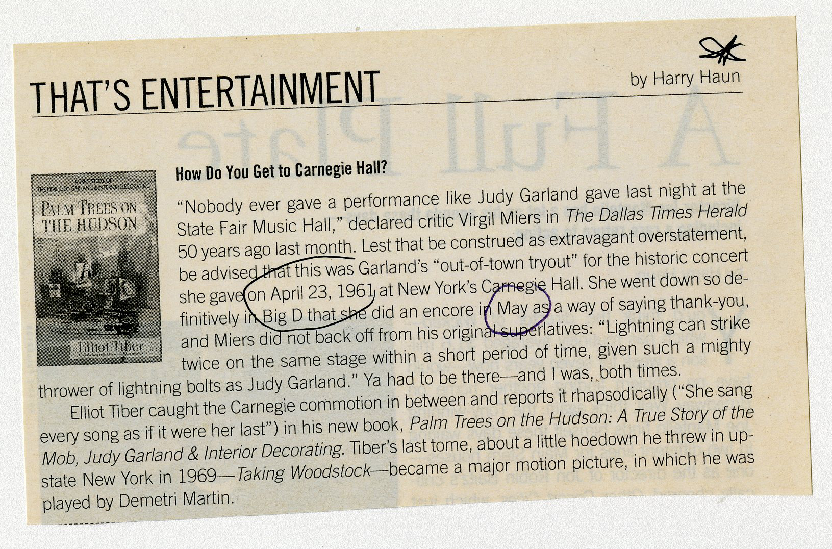 A magazine clipping entitled 'That's Entertainment' with information about the Judy Garland performance and a picture.