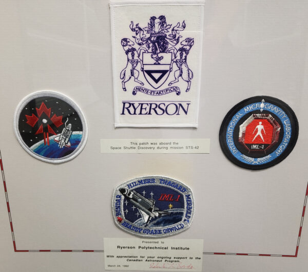 framed space shuttle discovery mission patches and Ryerson Crest patch