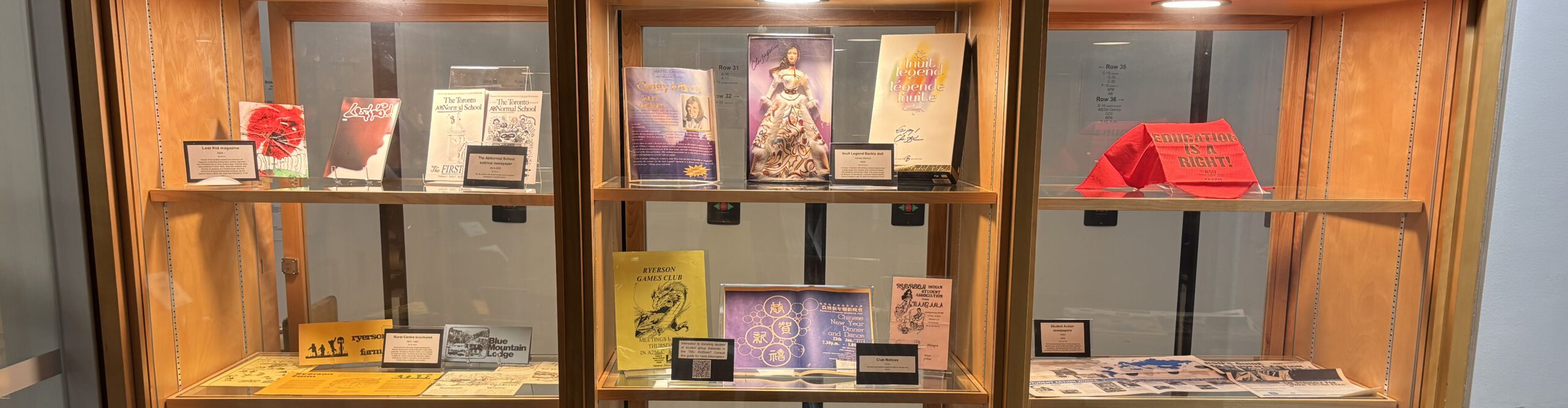 three lighted exhibit cases