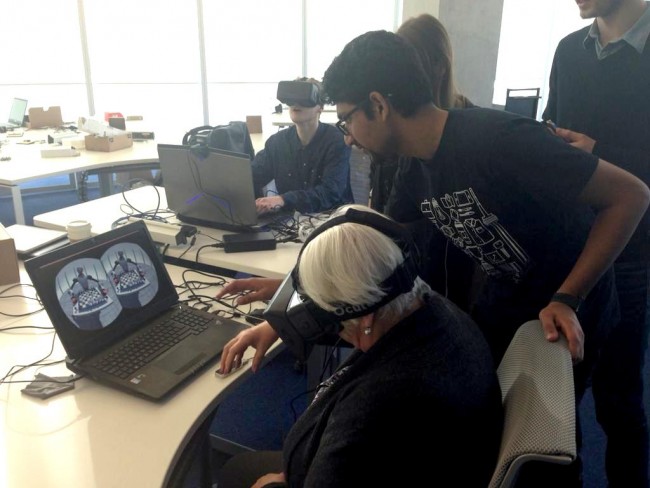 Photo of Ryerson Chief Librarian Madeleine Lefebvre using the Oculus Rift